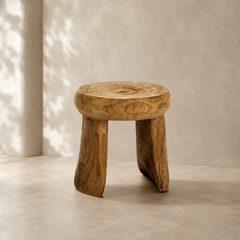 Wooden stool with a natural finish on a neutral background