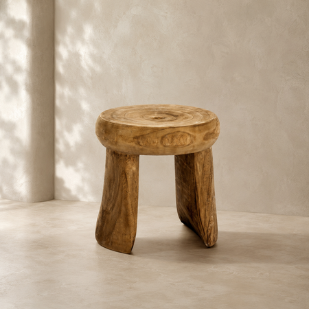 Wooden stool with a natural finish on a neutral background