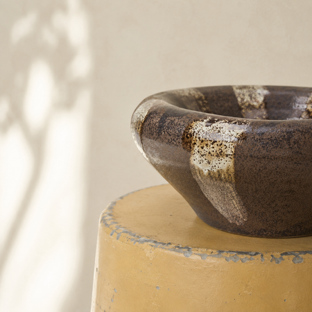 Speckled bowl on a yellow bucket