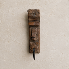 tribal wooden carved hook on beige backgound
