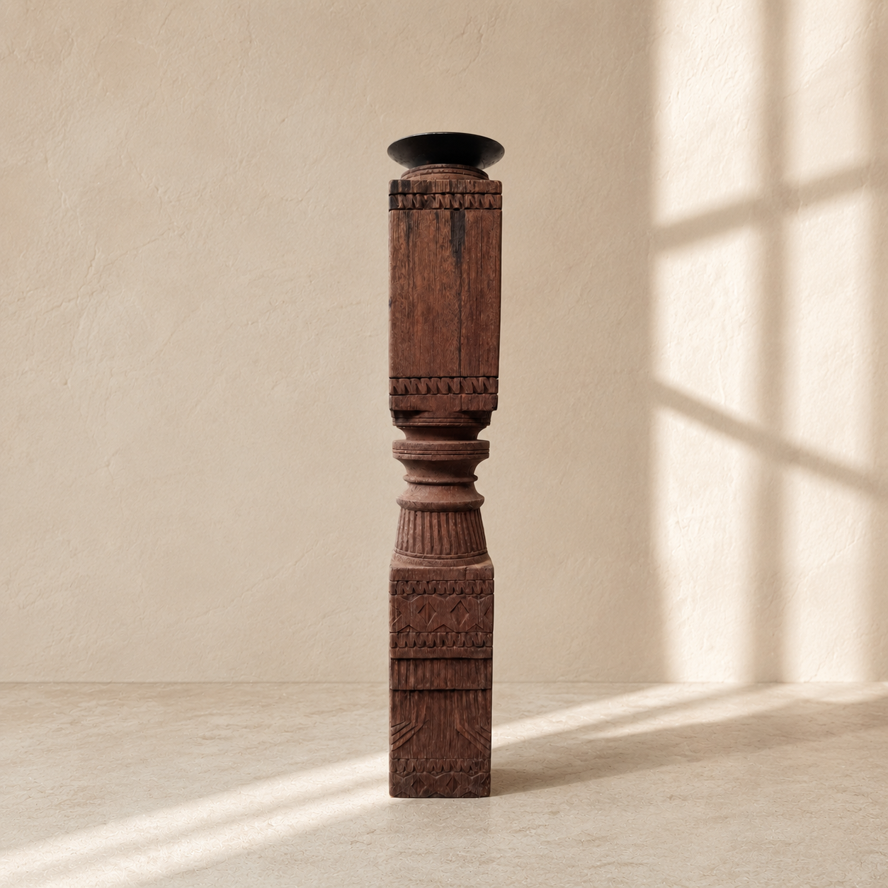 Decorative wooden candle stick with intricate carvings on a beige background